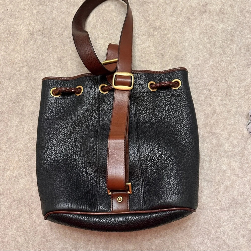 Vintage Dooney & Bourke Black w/Brown All Weather Leather Sling Small Backpack